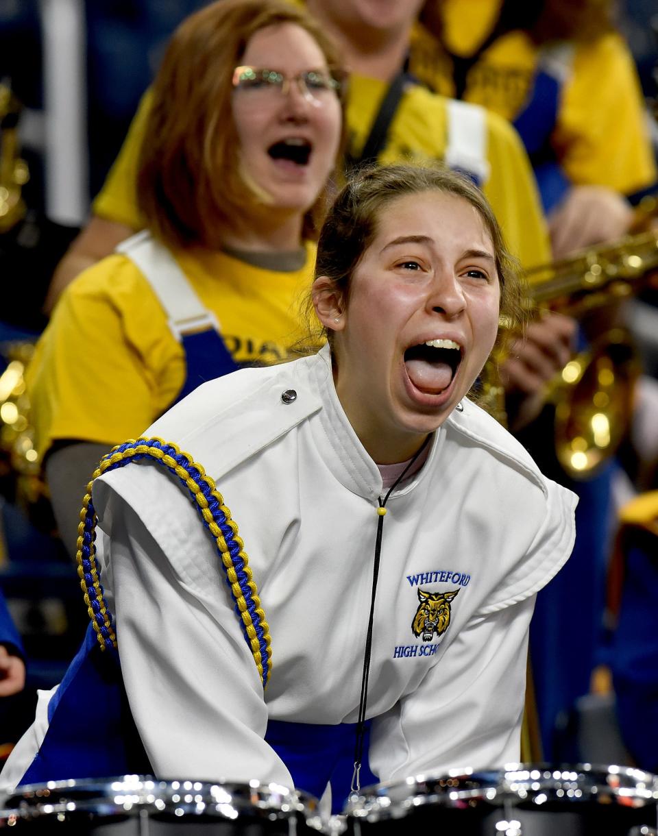 Whiteford senior Erica Holup member of the marching band screams out after the varsity football team took the lead 26-20 late in the fourth quarter in the Division 8 State Championships at Ford Field Friday.