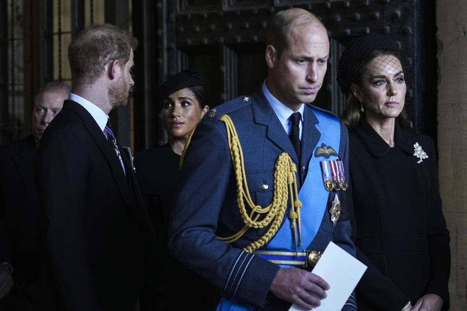 <p>Prince William and the Duchess of Cambridge, along with the Prince Harry and the Duchess of Sussex, share a sombre moment after a service for the reception of Queen Elizabeth II's coffin at Westminster Hall ahead of her lying in state. (Getty)</p> 