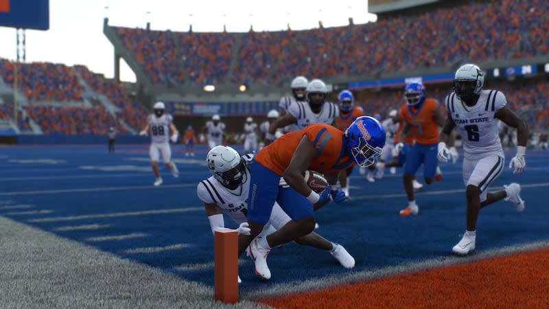 Boise State running back Ashton Jeanty scores a 26-yard touchdown in the third quarter during a simulated game between Utah State and Boise State in the EA Sports College Football 25 video game. | EA Sports College Football 25