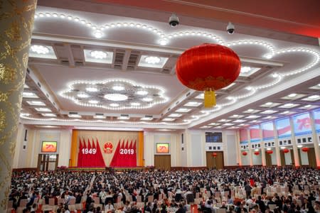 People attend a reception at the Great Hall of the People marking the 70th anniversary of the founding of the People's Republic of China in Beijing