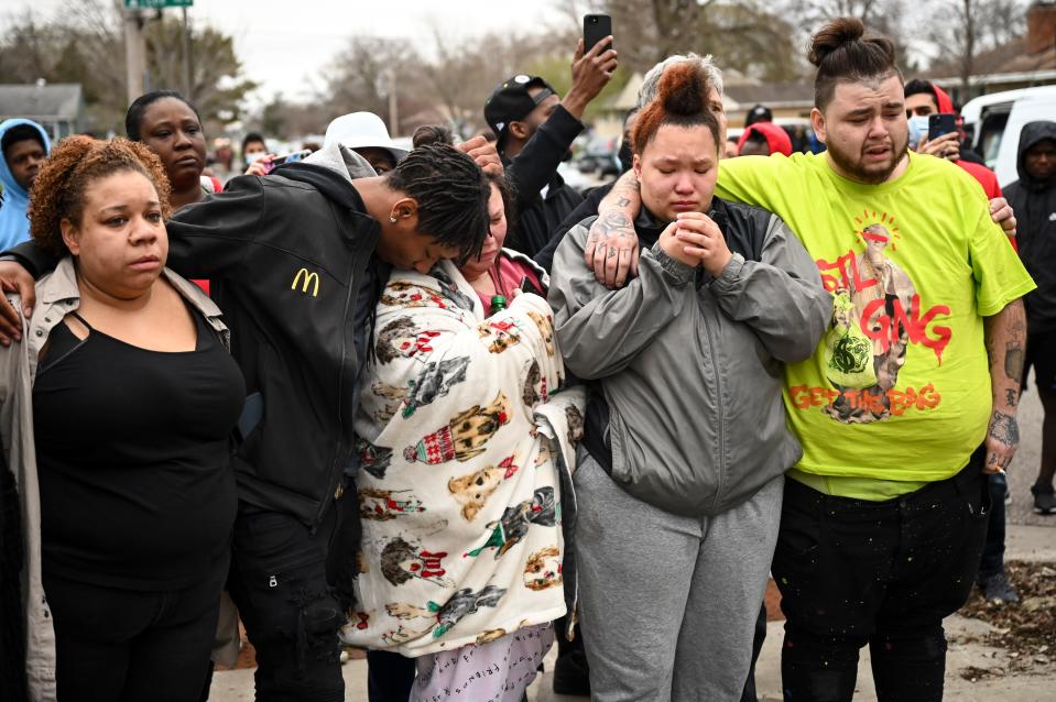 Family and friends of Daunte Wright, 20, grieve at 63rd Avenue North and Lee Avenue North hours after they say he was shot and killed by police, Sunday, April 11, 2021, in Brooklyn Center, Minn. Wright's mother, Katie Wright, stands at center.