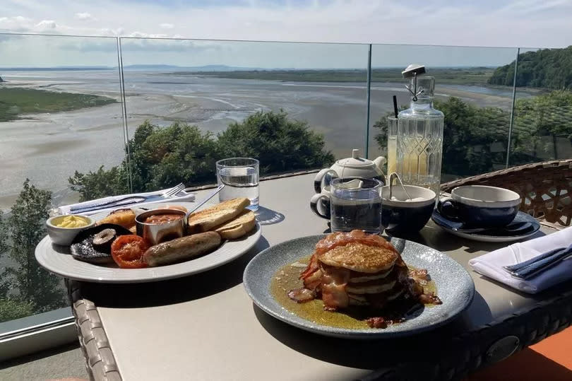 Food on a table with a sea view