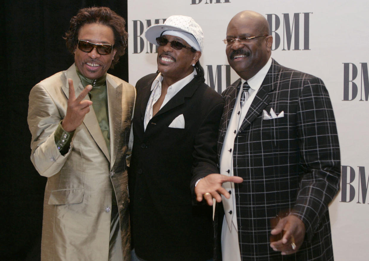 FILE - Members of The GAP Band, brothers Robert Wilson, from left, Charlie Wilson and Ronnie Wilson pose for photographers appear at the 2005 BMI Urban Music Awards in Miami Beach, Fla., on Aug. 26, 2005. Ronnie Wilson, multi-instrumentalist and founder of the funk group, has died. He was 73. His wife posted on Facebook that her husband died on Tuesday, Nov. 2, 2021. (AP Photo/Wilfredo Lee, File)