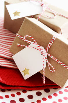 Handmade present boxes with tags on red napkins