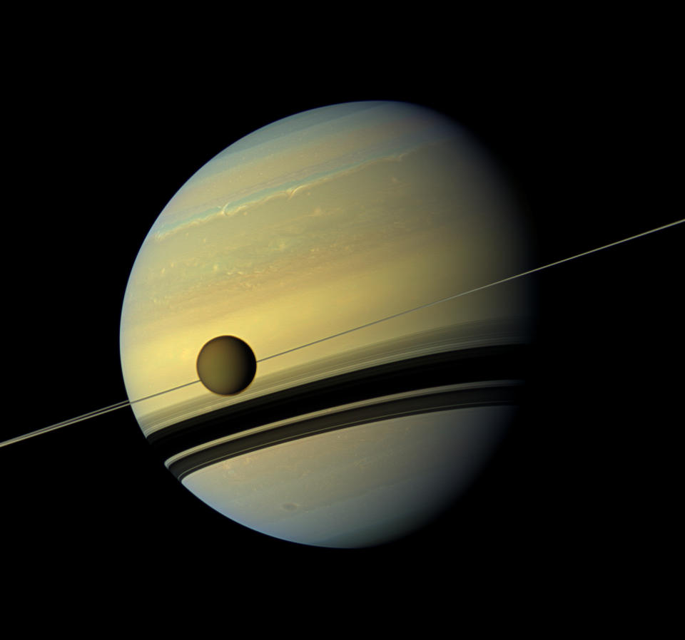 This six-image mosaic from NASA's Cassini spacecraft captures Saturn, its rings and the planet's giant moon Titan. The probe snapped the shots on May 6, 2012, when it was about 483,000 miles from Titan. Image scale is 29 miles per pixel on Titan.