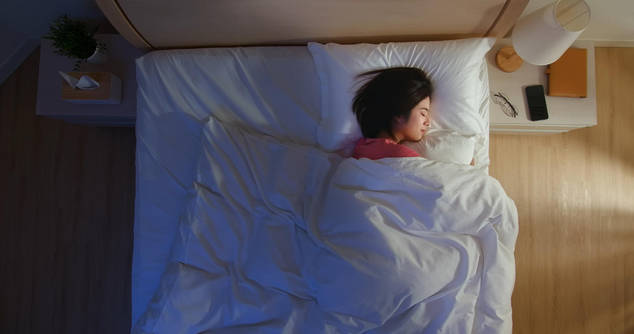 overlooking of asian woman sleep well with smile at night