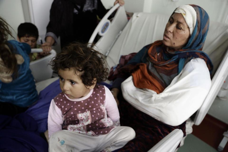 Um Yousef and her children recover in an Irbil hospital after they were badly injured in a mortar attack outside their home in Mosul, Iraq Sunday Jan. 15, 2017. As Iraqi forces secure a series of swift gains, civilian casualties in the Mosul operation are increasing and doctors at nearby hospitals say they are operating above capacity. (AP Photo/Susannah George)