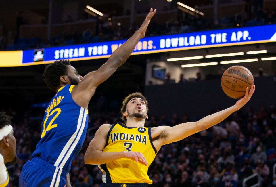 Jan 20, 2022; San Francisco, California, USA; Indiana Pacers guard Chris Duarte (3) shoots around Golden State Warriors forward Andrew Wiggins (22) during the second quarter at Chase Center. Mandatory Credit: D. Ross Cameron-USA TODAY Sports