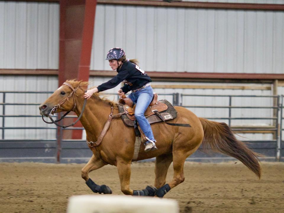 Tecumseh senior speed rider Ava Salenbien and her horse compete in an event at the 2021 Michigan Interscholastic Horesmanship Association state finals in October.