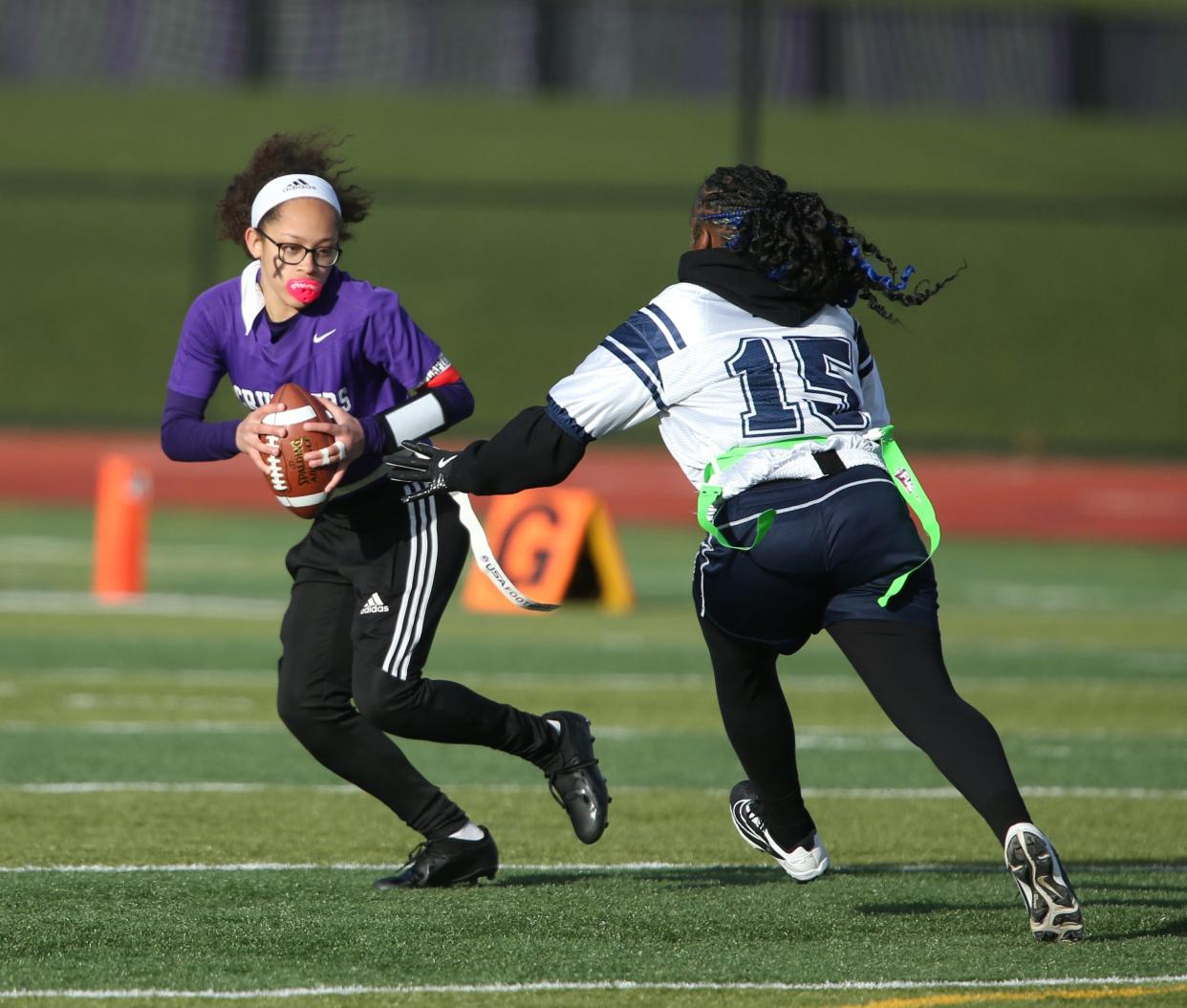 Poughkeepsie's On'Nesty Smith closes in on Monroe-Woodbury's Chloe Ahorrio during Thursday's game on April 4, 2024.