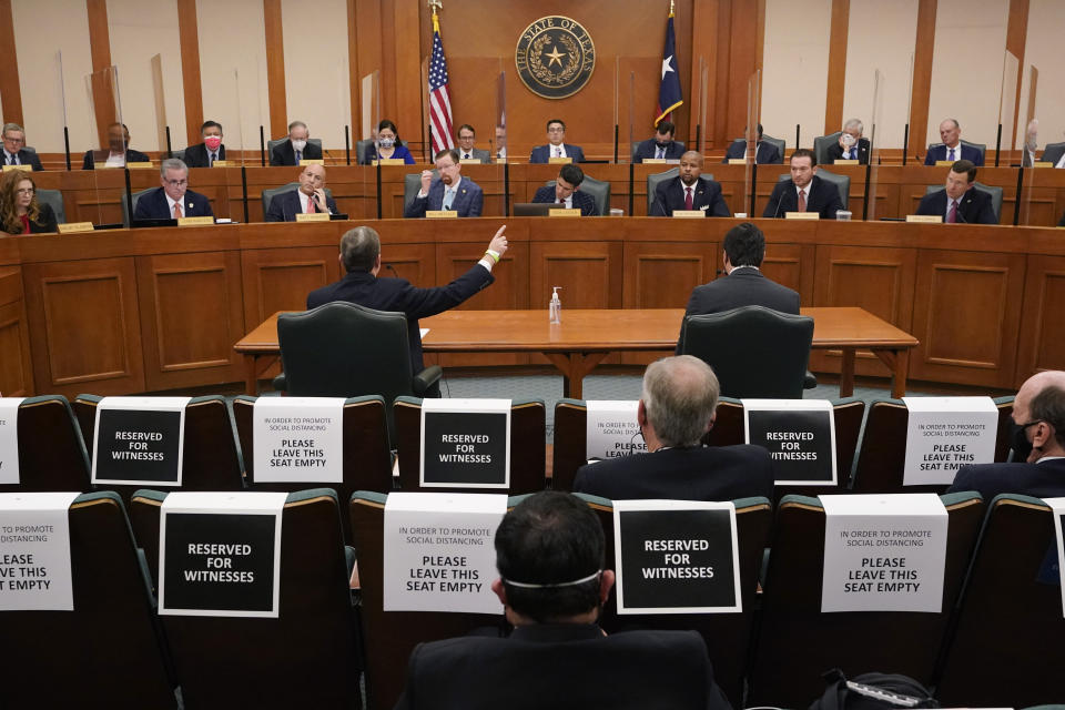 ADDS NAME Curtis Morgan, the CEO of Vistra Corp., at table left, testifies as the Committees on State Affairs and Energy Resources holds a joint public hearing to consider the factors that led to statewide electrical blackouts, Thursday, Feb. 25, 2021, in Austin, Texas. The hearings were the first in Texas since a blackout that was one of the worst in U.S. history, leaving more than 4 million customers without power and heat in subfreezing temperatures. (AP Photo/Eric Gay)