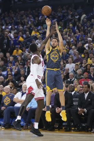 January 11, 2019; Oakland, CA, USA; Golden State Warriors guard Klay Thompson (11) shoots the basketball against Chicago Bulls forward Bobby Portis (5) during the second quarter at Oracle Arena. Mandatory Credit: Kyle Terada-USA TODAY Sports