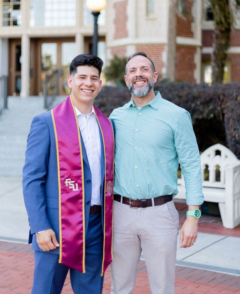 Daniel Zuniga, a Rhodes finalist, poses with Craig Filar, associate dean for Undergraduate Studies and director of the Office of National Fellowships, before Florida State University’s commencement in May 2023.