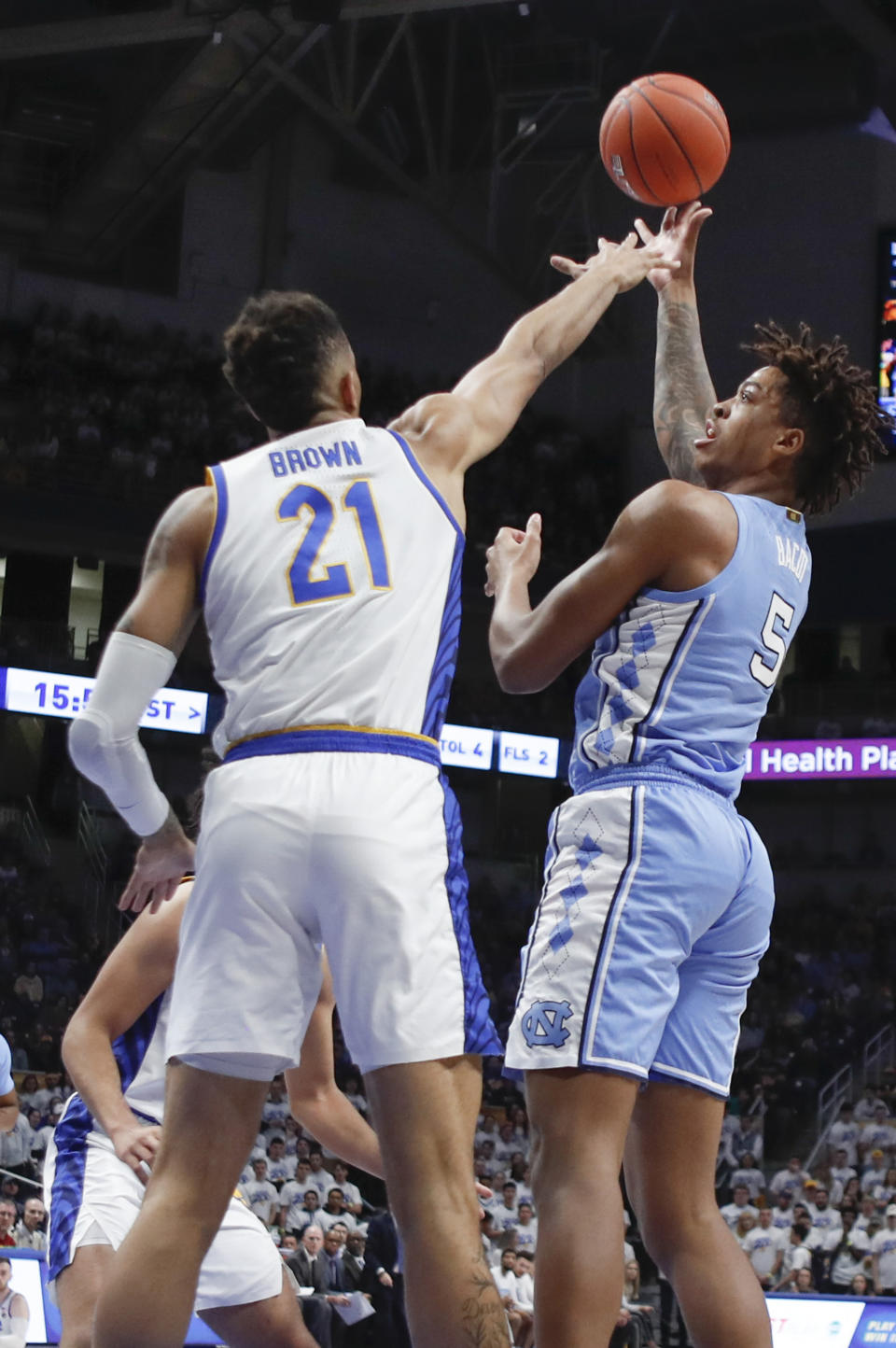 North Carolina's Armando Bacot (5) shoots over Pittsburgh's Terrell Brown (21) during the first half of an NCAA college basketball game, Saturday, Jan. 18, 2020, in Pittsburgh. (AP Photo/Keith Srakocic)