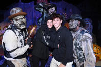 <p>holding each other close at Knott's Scary Farm in Buena Park, California, on Sept. 18.</p>