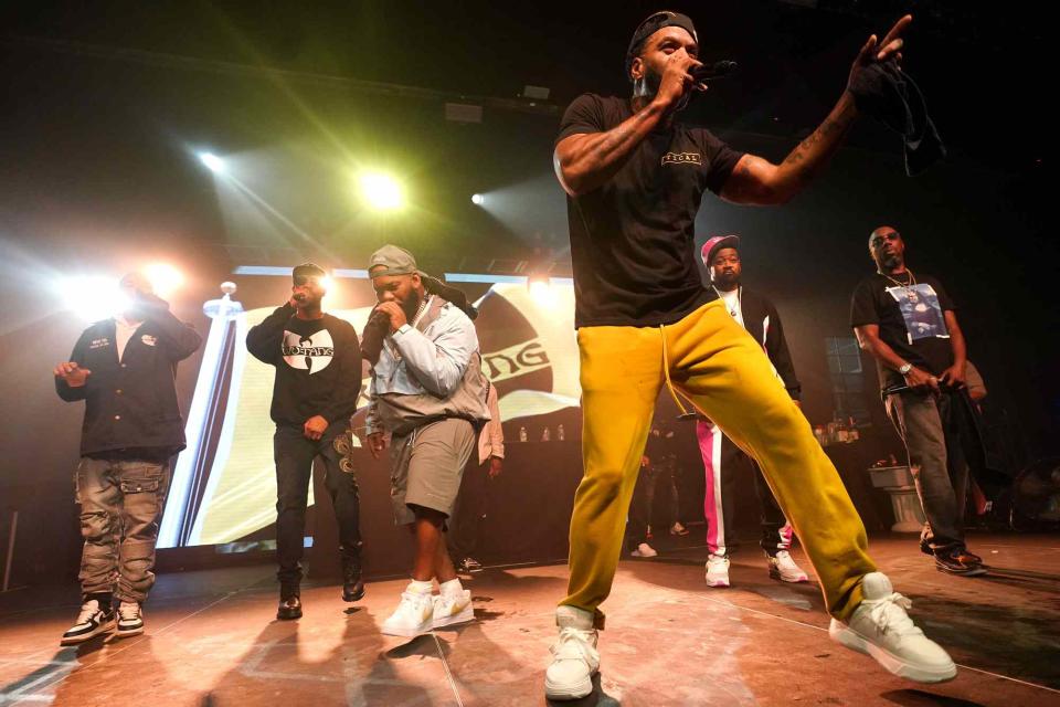 <p>Bennett Raglin/Getty </p> Wu-Tang Clan performing in August 2023 in New York.