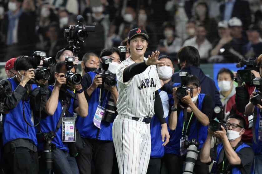 Shohei Ohtani of Japan gestures after finishing the quarterfinal game between Italy and Japan at the World Baseball Classic (WBC) at Tokyo Dome in Tokyo, Japan, Thursday, March 16, 2023. (AP Photo/Eugene Hoshiko)