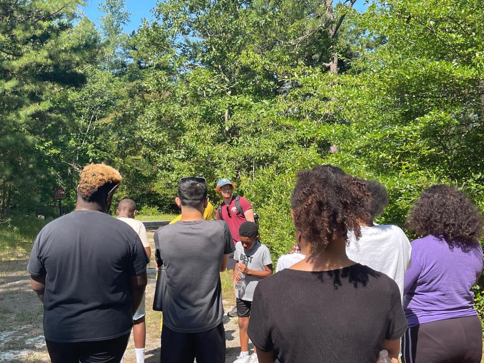 Jackson resident Zachary Soricelli (center, red shirt) leads a tour of the Pine Barrens for youths from Camden.