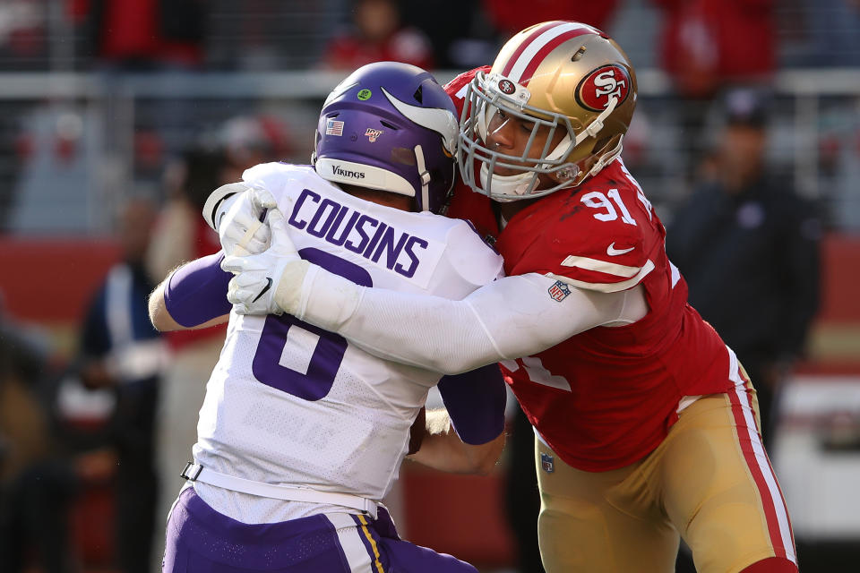 Kirk Cousins of the Minnesota Vikings is sacked by Arik Armstead of the San Francisco 49ers. (Photo by Sean M. Haffey/Getty Images)