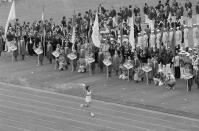 Soviet athlete Sergei Belov runs with the Olympic flame past the Olympic team from Afghanistan during opening ceremonies of the 1980 Summer Olympic Games in Moscow on Saturday, July 20, 1980. A number of teams boycotted the ceremony to protest Soviet intervention into Afghanistan. (AP Photo)