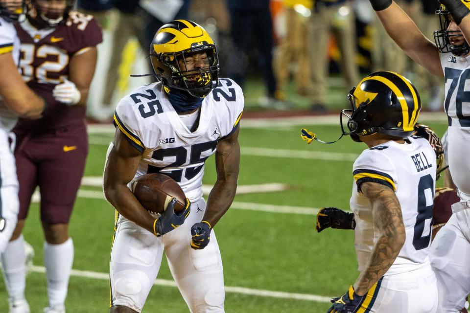 Michigan Wolverines running back Hassan Haskins celebrates after scoring a touchdown in the first half against Minnesota at TCF Bank Stadium, Oct. 24, 2020.