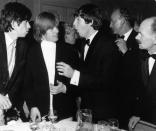<p> It's the Rolling Stones meeting the Beatles (and having a very animated conversation, looks like)! The two bands were contemporaries, and depending on whom you ask, there might have been some rivalry. But the two titans of music ended up being friends and collaborators. </p>