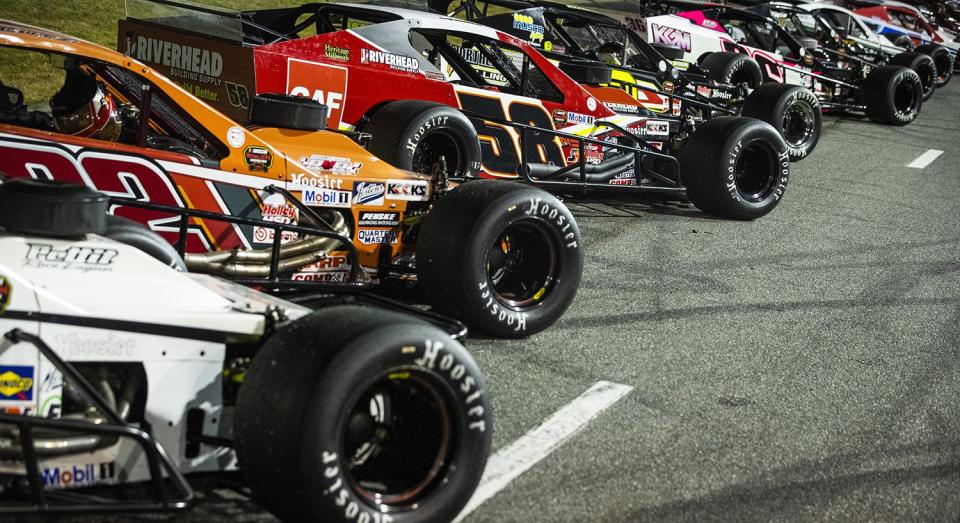 Cars line up before the New Smyrna Visitors Bureau 200 for the NASCAR Whelen Modified Tour during night 2 of the World Series of Asphalt Stock Car Racing at New Smyrna Speedway in New Smyrna, Florida on February 12, 2022. (Adam Glanzman/NASCAR)