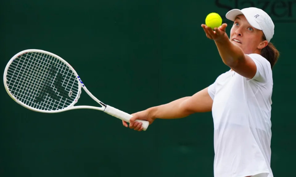 <span>Iga Swiatek winds up for a serve that she is confident is improved for Wimbledon this year.</span><span>Photograph: Javier García/REX/Shutterstock</span>