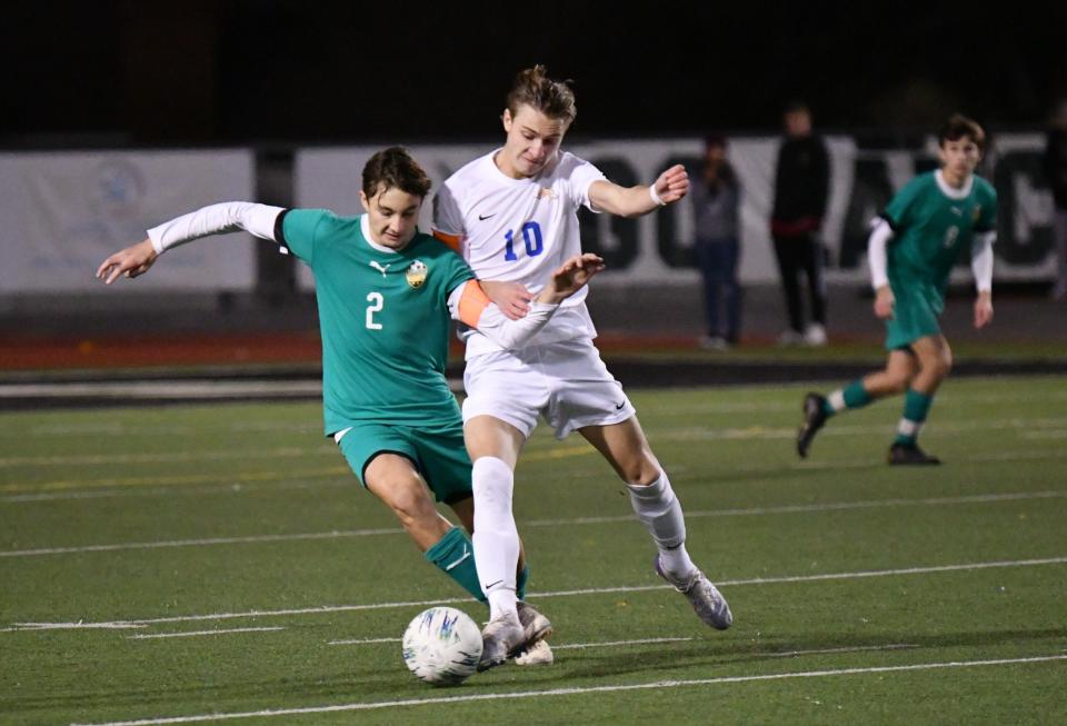 Thousand Oaks High's Gavin Arce (left) and Agoura's Justin Sosa (right) battle for the ball during a Marmonte League match Friday night. The visiting Chargers won 4-2.