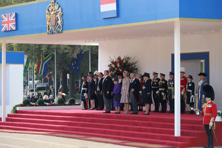 Britiain's Prime Minister Theresa May, Secretary of State for Foreign Affairs Jeremy Hunt, King Willem-Alexander of the Netherlands, Queen Elizabeth, Queen Maxima of the Netherlands, Prince Charles, and Camilla, Duchess of Cornwall stand during a ceremonial welcome at the start of a state visit at Horse Guards Parade, in London, Britain October 23, 2018. Christopher Furlong/Pool via REUTERS