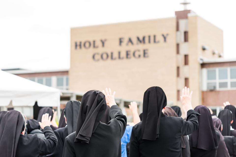 The Franciscan Sisters of Christian Charity offer a blessing during the Unveiling a New Chapter event at Holy Family College Sept. 19, 2019. The 136-year-old college was forced to close May 2020 because of the "significant" financial hit from coronavirus.