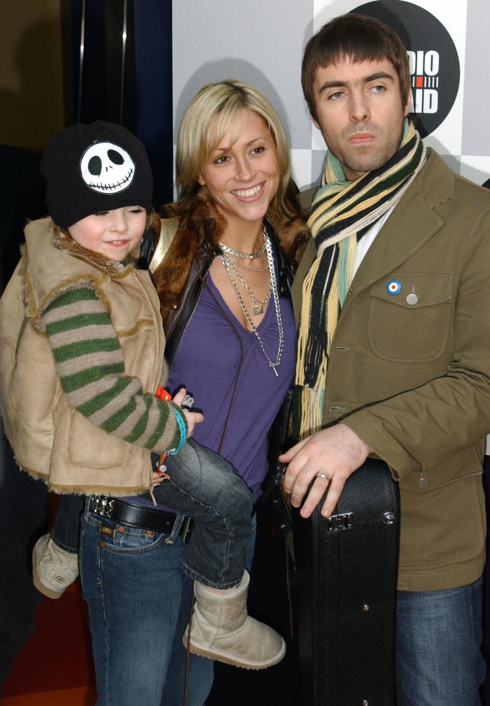 Liam Gallagher, his partner Nicole Appleton and their son Gene arriving to take part in a 268 station, 12 hour commercial radio show to raise money for Tsunami victims.