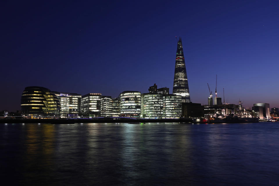The view across the River Thames including The Shard Skyscraper and City Hall at night (Photo by Oli Scarff/Getty Images)