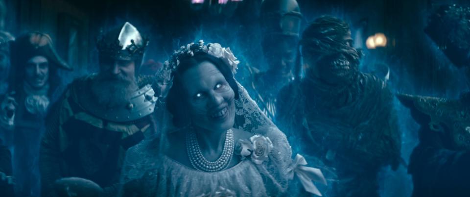 The Bride (Lindsay Lamb, center) is one of 999 spirits populating an old New Orleans manor in "Haunted Mansion."