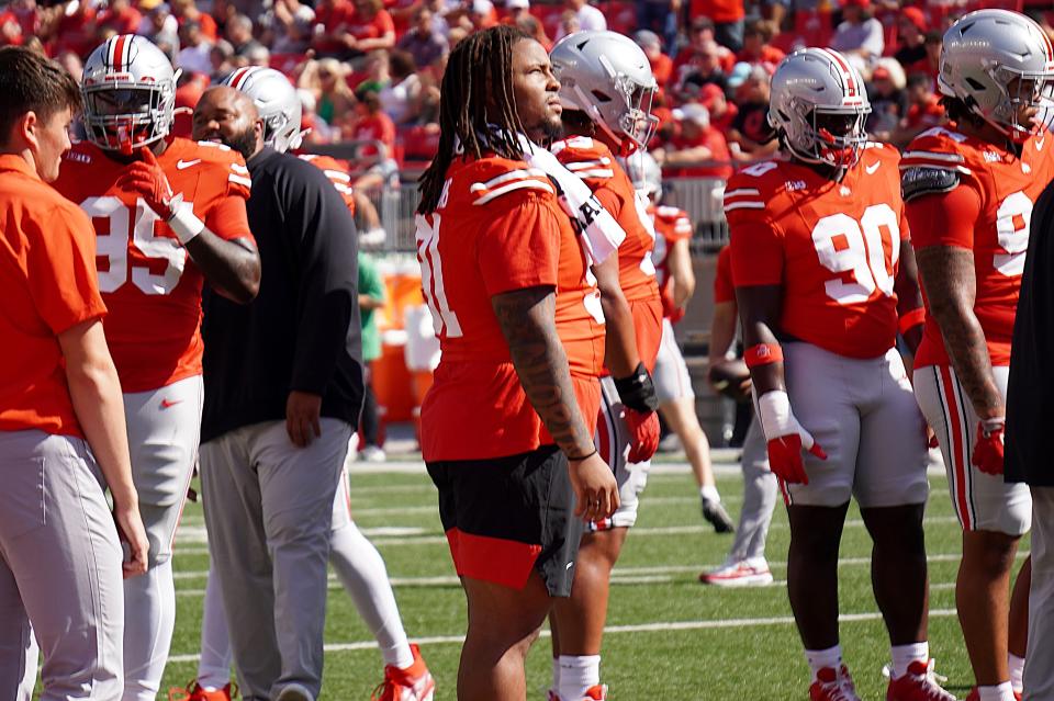 Sept. 21, 2024; Columbus, Ohio, USA; Ohio State Buckeyes defensive lineman Tyleik Williams (91) watches warm-ups before before an NCAA Division I football game between against the Marshall University Thundering Herd at Ohio Stadium on Saturday.