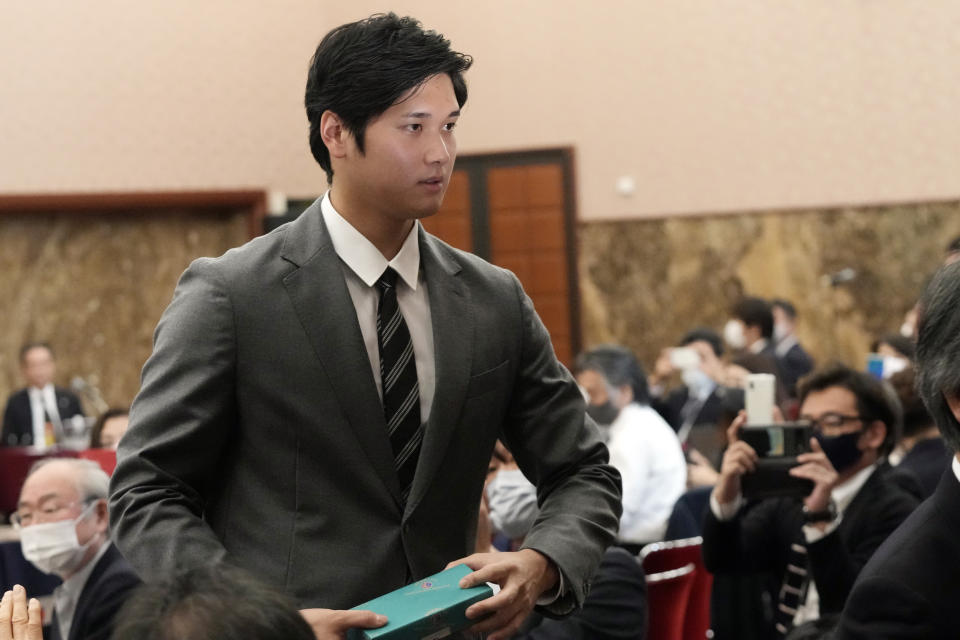 Los Angeles Angels' Shohei Ohtani leaves after attending a press conference at the Japan National Press Club Monday, Nov. 15, 2021, in Tokyo. (AP Photo/Eugene Hoshiko)
