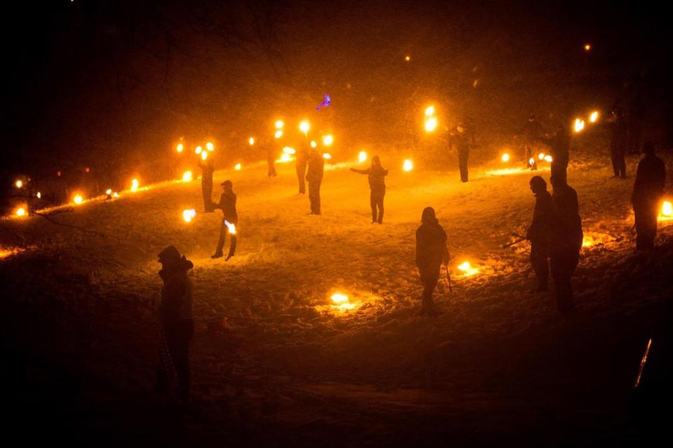 In driving snow torches representing the return of the sun are used in a symbolic battle against winter on February 4, 2012 in Huddersfield, England (Bethany Clarke/Getty Images)