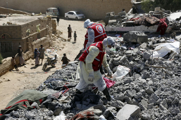 Rescue members search for victims among rubble from over victims struck by aerial attacks carried out by jet crafts of the coalition led by Saudi Arabia targeting a prison in the Houthi strong-hold Saadah Province, on January 22, 2022 in Saadah, Yemen. (Mohammed Hamoud/Getty Images)