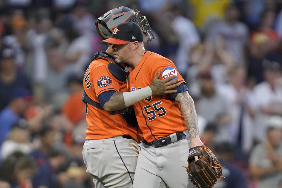 Houston Astros pitcher Ryan Pressly (55) celebrates with catcher Martin Maldonado after the Astros defeated the Boston Red Sox in a baseball game Wednesday, Aug. 30, 2023, in Boston. (AP Photo/Steven Senne)