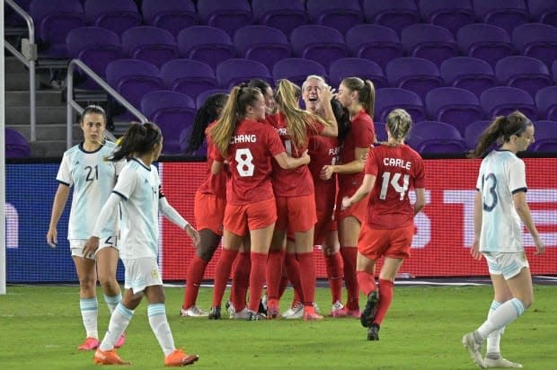 Canada players celebrate midfielder Sarah Stratigakis' goal during the team's 1-0 win against Argentina at the SheBelieves Cup on Sunday. Despite Canada's 1-2 record in the competition, new head coach Bev Priestman believes the group is on the right track. (Phelan M. Ebenhack/The Associated Press - image credit)