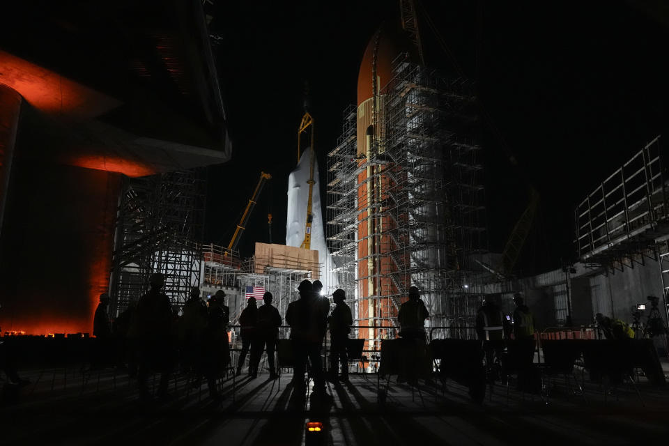Space Shuttle Endeavour is lifted into the site of the future Samuel Oschin Air and Space Center on Monday, Jan. 29, 2024, in Los Angeles. (AP Photo/Ashley Landis)