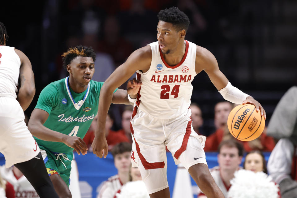 BIRMINGHAM, ALABAMA - MARCH 16: Brandon Miller #24 of the Alabama Crimson Tide dribbles the ball against Jalen Jackson #4 of the Texas A&M-CC Islanders during the second half in the first round of the NCAA Men's Basketball Tournament at Legacy Arena at the BJCC on March 16, 2023 in Birmingham, Alabama. (Photo by Alex Slitz/Getty Images)