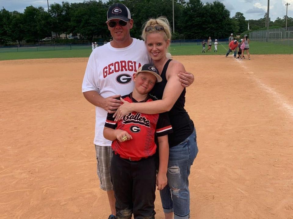 Staci Rice with her husband and son on a baseball field before starting semaglutide