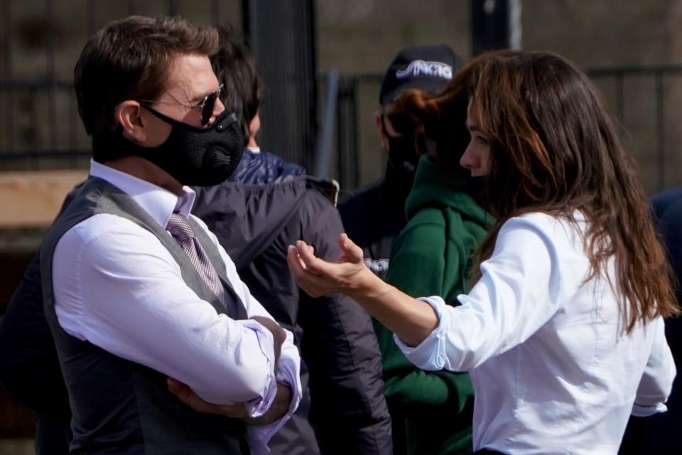 Actors Tom Cruise, left, and Hayley Atwell talk to each other during a break in the shooting of the film Mission Impossible 7 a in Rome, Tuesday, Oct. 13, 2020. (AP Photo/Andrew Medichini)