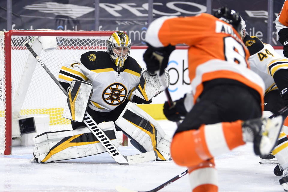 Boston Bruins goaltender Jeremy Swayman looks for the puck during the third period of an NHL hockey game against the Philadelphia Flyers, Tuesday, April 6, 2021, in Philadelphia. The Bruins won 4-2. (AP Photo/Derik Hamilton)