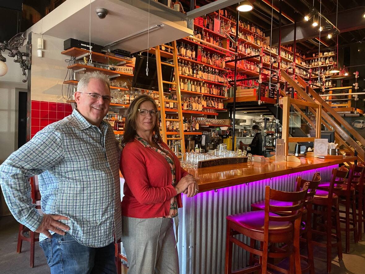 Eric, left, and Allura Fergie, the longtime owners of Fets Whisky Kitchen, are stepping away from the restaurant business in December. But they'll still be keeping busy promoting specialty whisky and fighting the B.C. liquor branch in court. (Josh Grant/CBC - image credit)