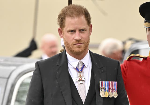 <p>Andy Stenning - WPA Pool/Getty</p> Prince Harry arrives for the coronation of King Charles and Queen Camilla in London on May 6, 2023.