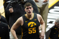 Iowa center Luka Garza walks off the court after an NCAA college basketball game against Wisconsin, Sunday, March 7, 2021, in Iowa City, Iowa. Garza, a senior, was playing his last home game at Iowa. Iowa won 77-73. (AP Photo/Charlie Neibergall)