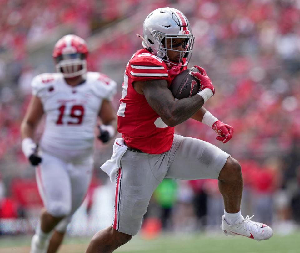 Ohio State running back TreVeyon Henderson runs for a touchdown against Youngstown State on Saturday.