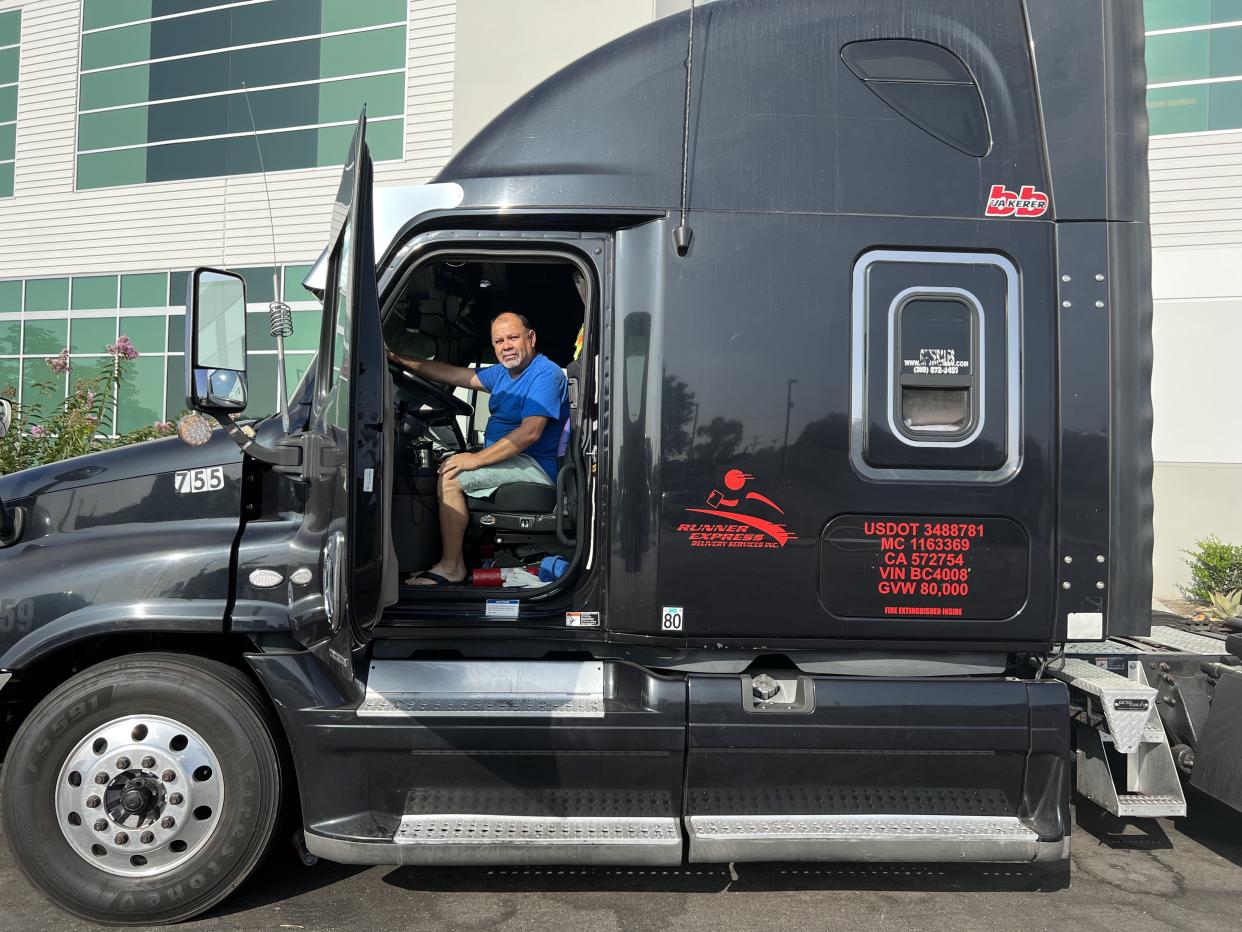 Mario Moreno, a 35-year veteran truck driver, is in limbo as the state-level labor rules start applying to them creating another headwind for the industry. 